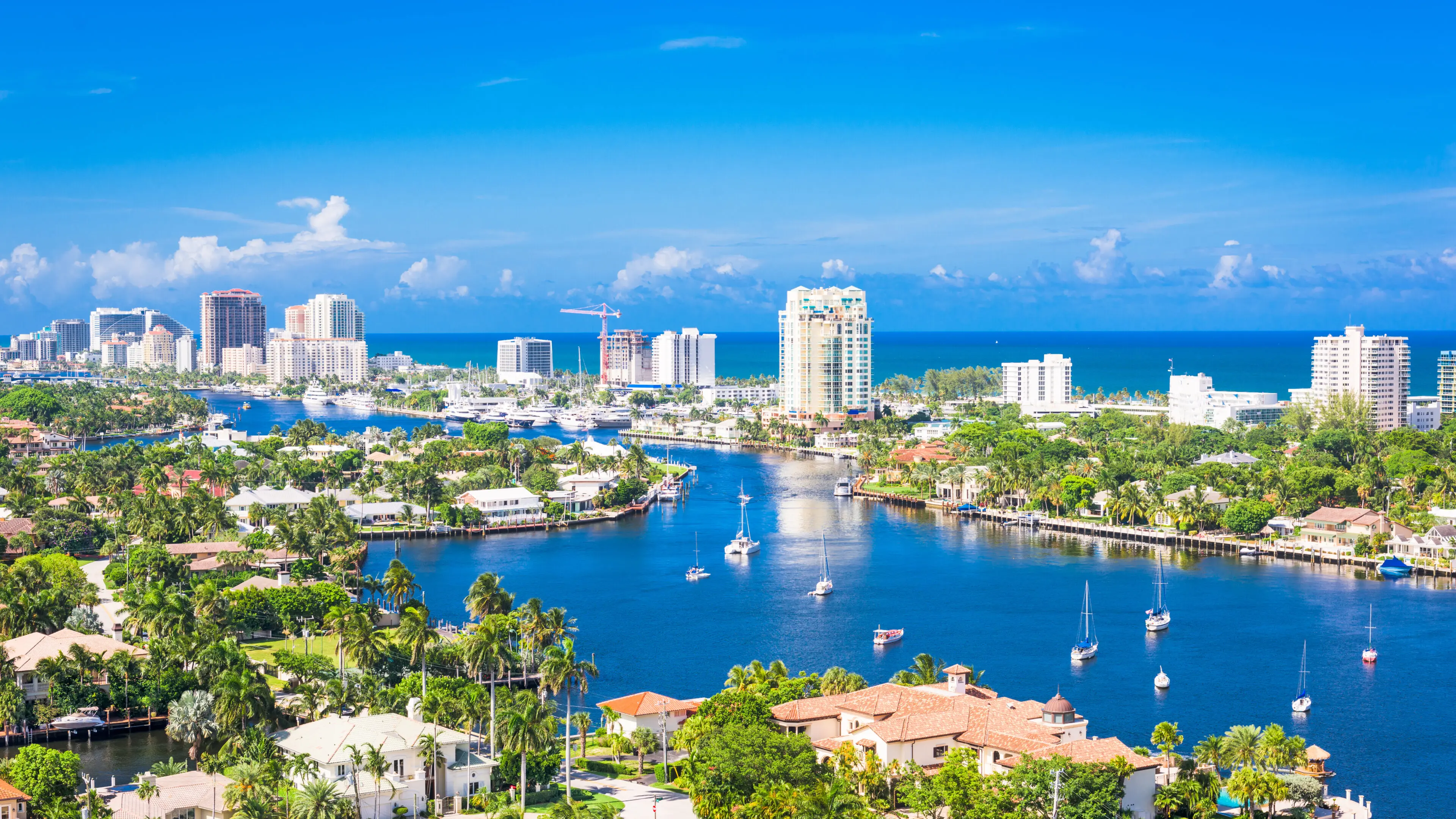 Aerial view of waterfront skyline and boats